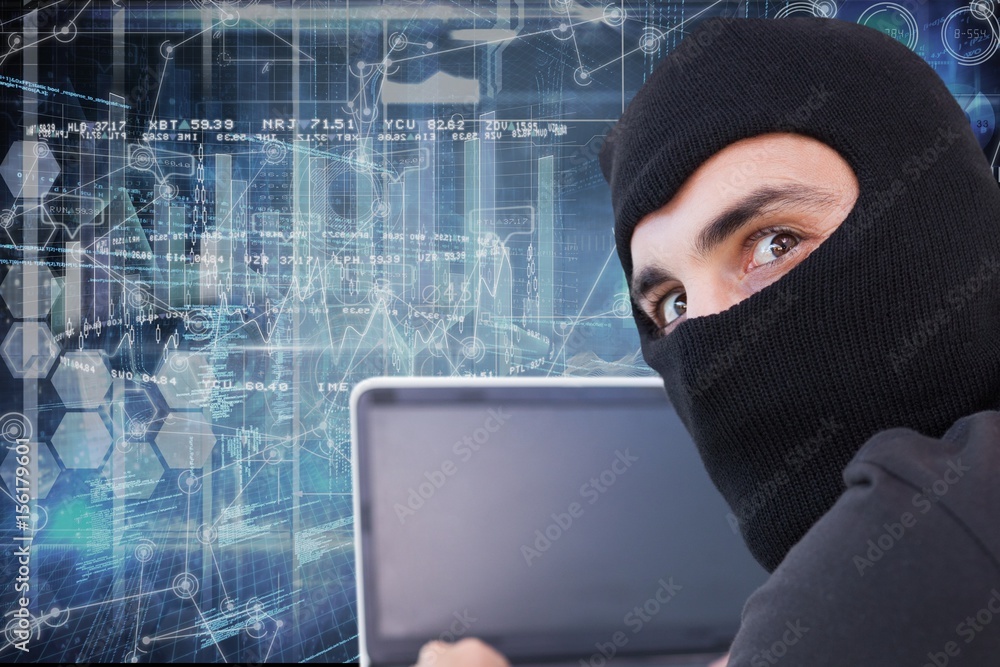 Hacker using his computer with cover face Hacker using his computer with cover face
