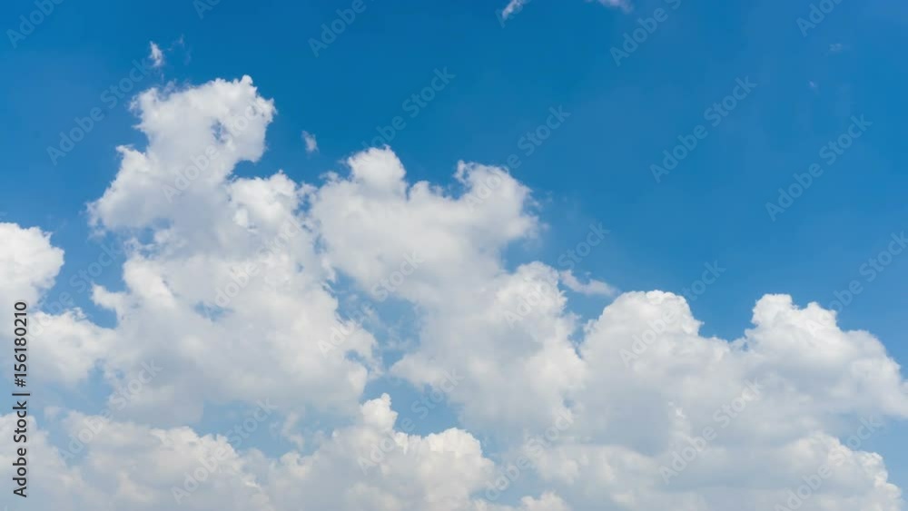 Time lapse clip of white fluffy clouds over blue sky Time lapse clip of white fluffy clouds over blue sky