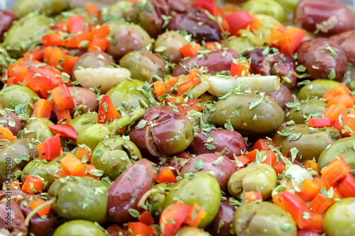Spanish style seasoned olives background. photo