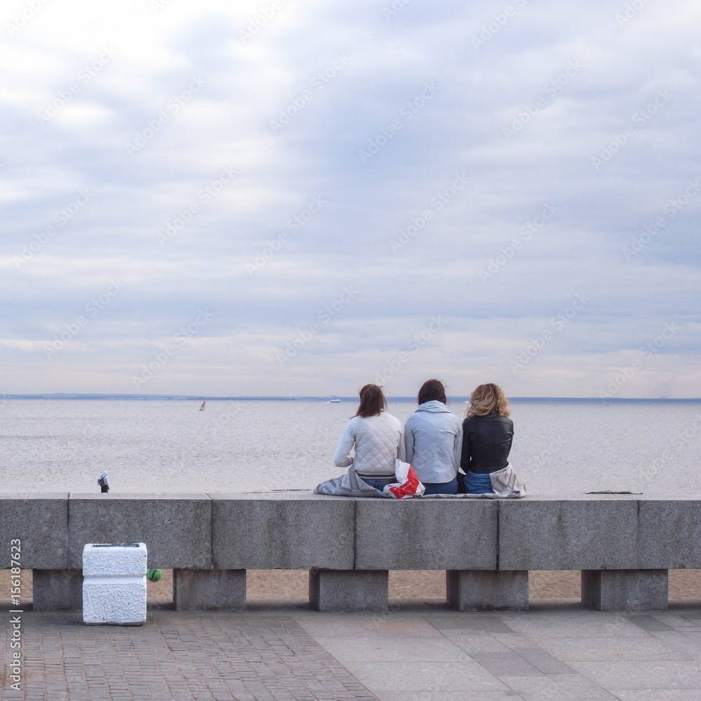 Dreams. Three girlfriends are looking at the sea. Dreams. Three girlfriends are looking at the sea.