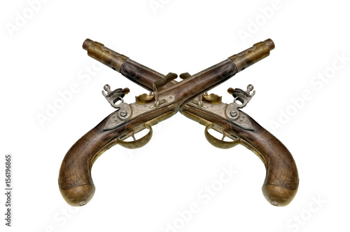 Two antique silicic pistols isolated on white background. photo