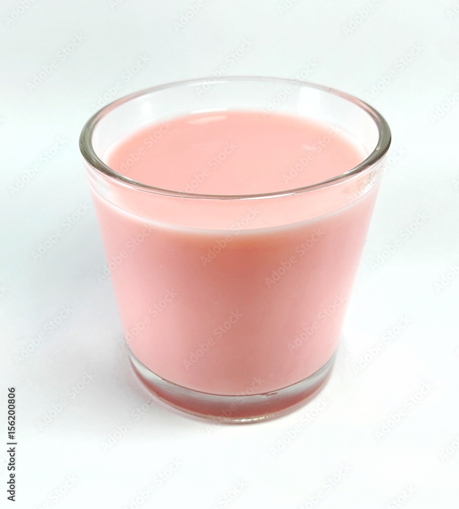Strawberry milk in glass isolated on white Strawberry milk in glass isolated on white