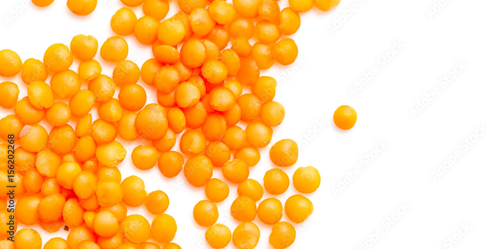 Red lentils on a white background