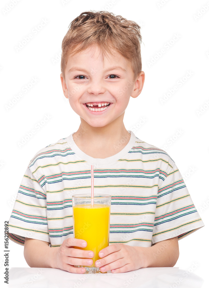 Portrait of happy little boy drinking refreshing orange juice. Smiling child with glass of fresh lemonade. Portrait of happy little boy drinking refreshing orange juice. Smiling child with glass of fresh lemonade.