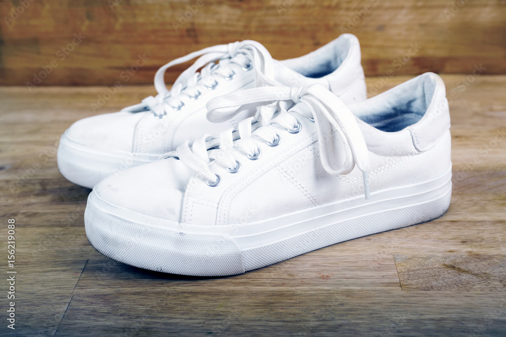 Pair of white sneakers with laces Pair of white sneakers with laces