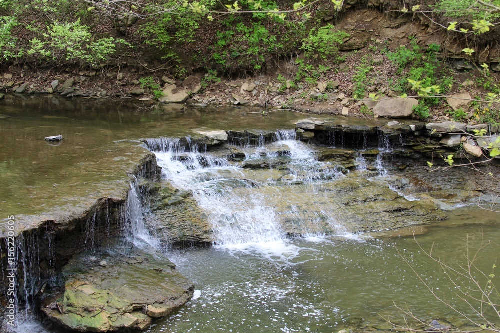 The waterfall ate the end of the creek. The waterfall ate the end of the creek.