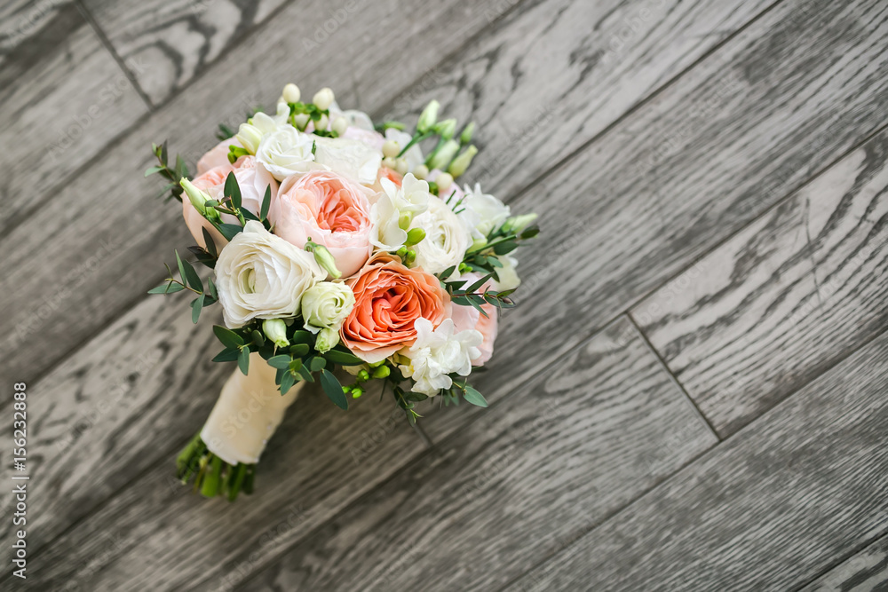 Bridal bouquet on the wooden floor Bridal bouquet on the wooden floor