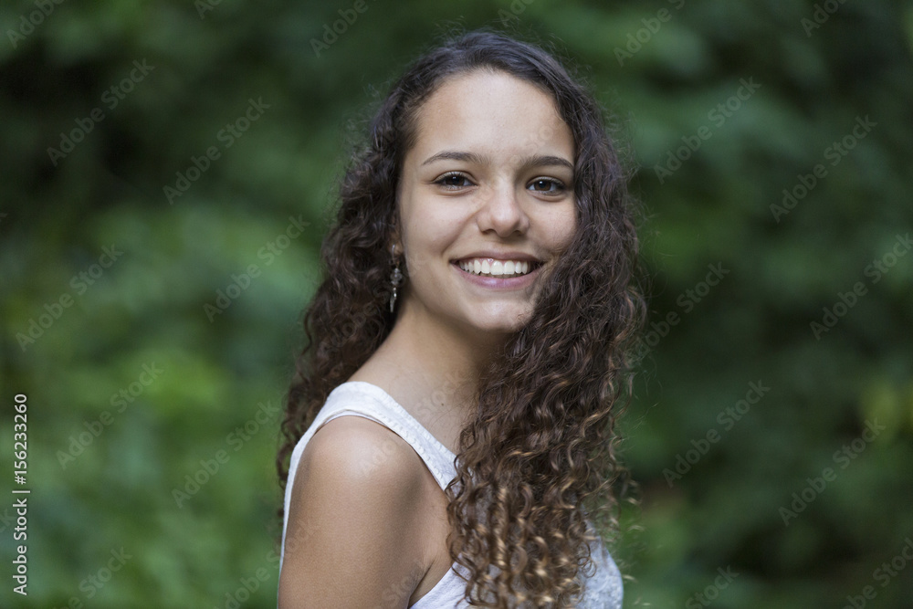 Portrait of Teenage Girl Laughing / Portrait of Brunette Teenage Girl Laughing in a Park Portrait of Teenage Girl Laughing / Portrait of Brunette Teenage Girl Laughing in a Park
