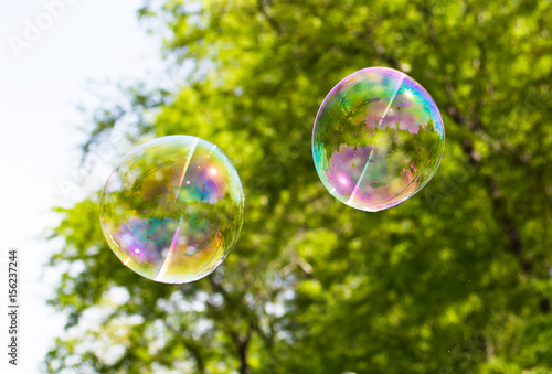 Beautiful soap bubbles fly in the nature © schankz