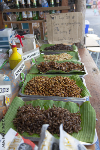 deep fried insects as finger food offered on banana leaves © Ananda