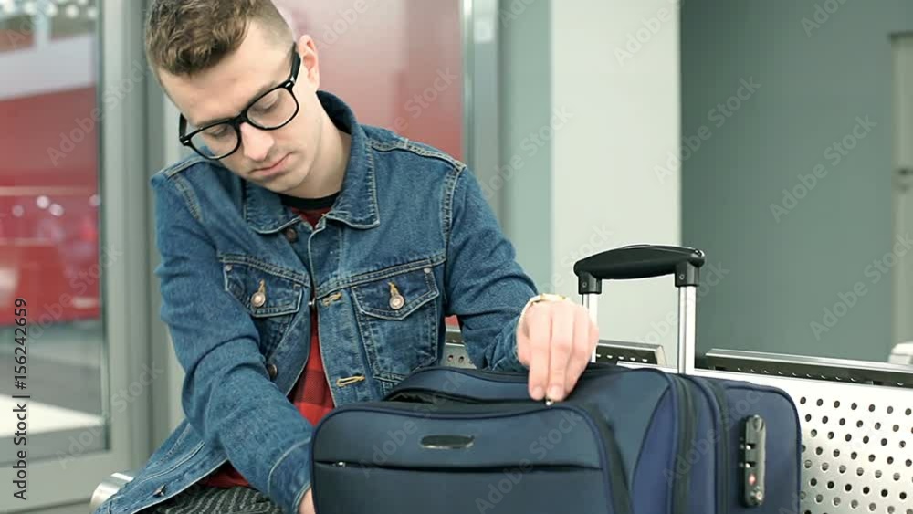 Happy man takes tablet and starts using it on the train station, steadycam shot
Happy man takes tablet and starts using it on the train station, steadycam shot