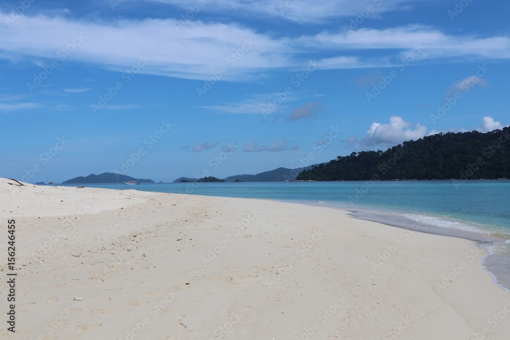 White sand beach with boat blue sea background at Thailand
