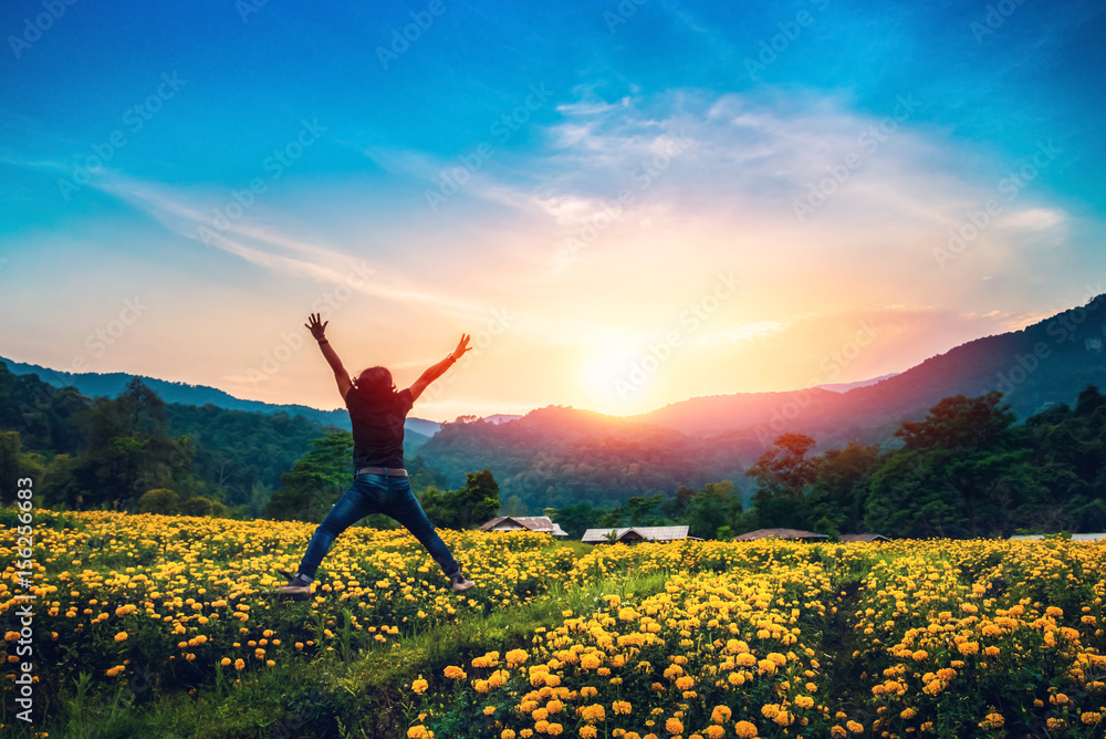 Men jump yellow field of flowers. Sunset atmosphere Men jump yellow field of flowers. Sunset atmosphere