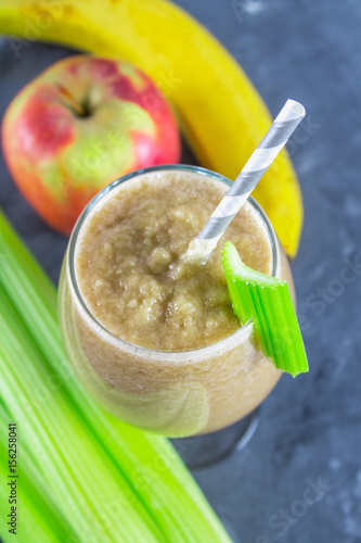 Green smoothie with celery, banana and apple photo