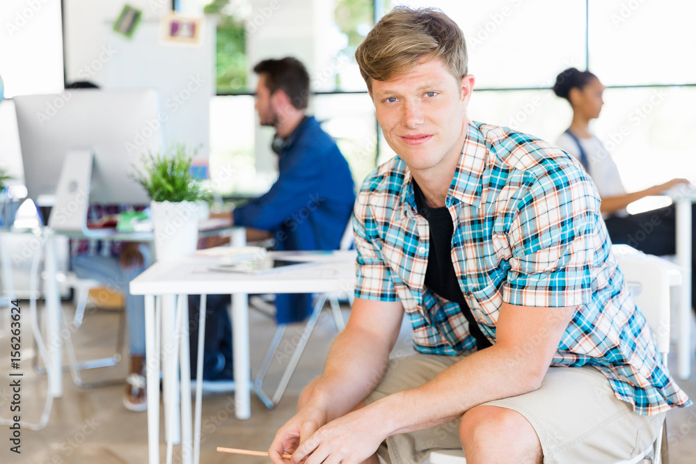 Fototapeta premium Young man working in office