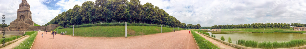 Fototapeta premium LEIPZIG, GERMANY - JULY 2016: Tourists visit Battle of Nations Monument. Leipzig attracts 3 million people annually