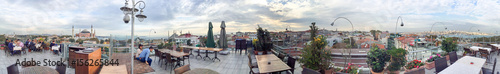 Photography ISTANBUL - OCTOBER 2014: Tourists enjoy city view from a rooftop