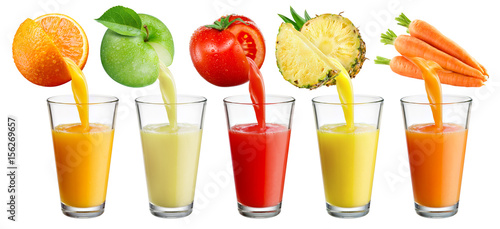 Fresh juice pours from fruit and vegetables into the glass isolated on white background.