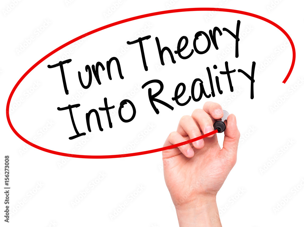 Man Hand writing Turn Theory Into Reality with black marker on visual screen Man Hand writing Turn Theory Into Reality with black marker on visual screen