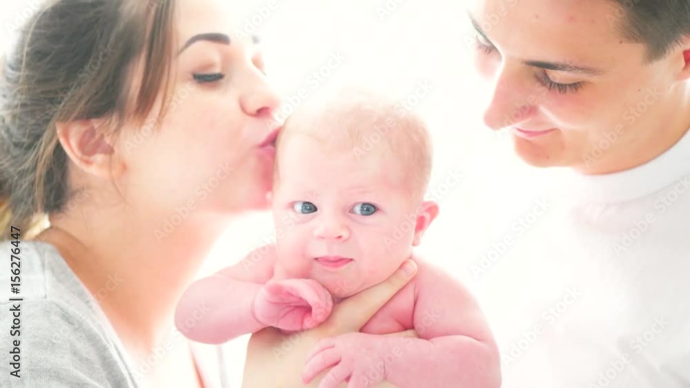 Happy young family. Father, mother and their newborn baby. Parenthood concept. 3840X2160 4K UHD video Happy young family. Father, mother and their newborn baby. Parenthood concept. 3840X2160 4K UHD video