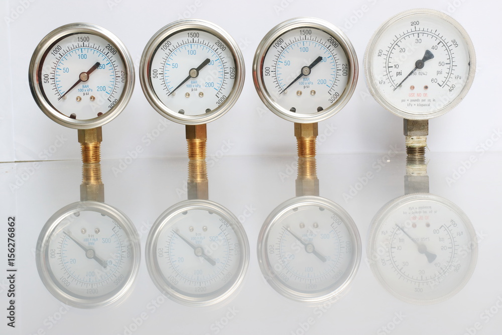 High pressure gauge meters or manometers for LNG or LPG natural gas distribution station plant or factory facility isolated on white background.Pressure gauge in oil and gas production process. High pressure gauge meters or manometers for LNG or LPG natural gas distribution station plant or factory facility isolated on white background.Pressure gauge in oil and gas production process.
