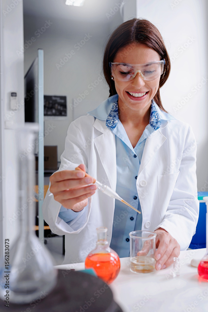 Scientist carrying out experiment in research laboratory. Medical chemist lab. Scientist carrying out experiment in research laboratory. Medical chemist lab.