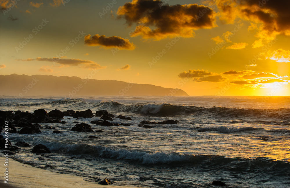 Fototapeta premium Sunset at Hawaii's north shore with waves