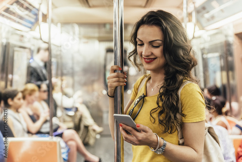 Canvas Print Beautiful woman using phone.