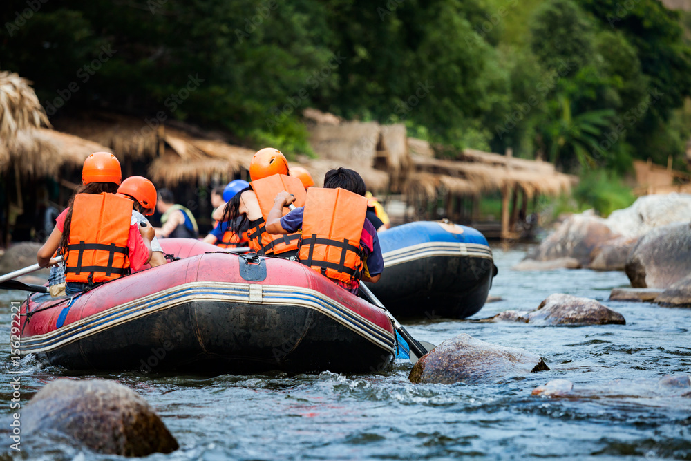 Group of traveler in the inflatable rafting on the river, extreme and fun sport Group of traveler in the inflatable rafting on the river, extreme and fun sport