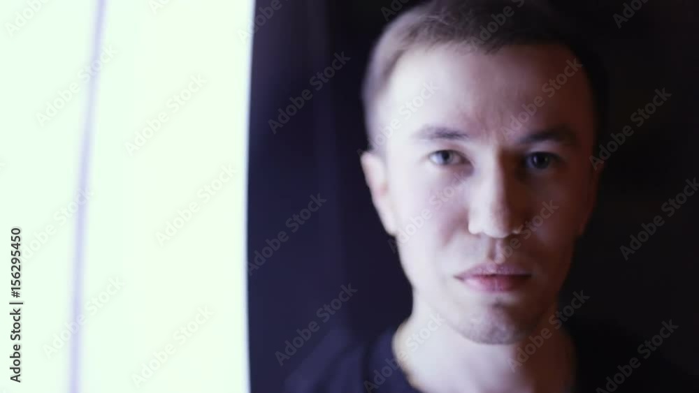 Moving shot of expressive young man in the nightclub. Trendy fashion Caucasian beauty style party night club disco concert hall band Moving shot of expressive young man in the nightclub. Trendy fashion Caucasian beauty style party night club disco concert hall band