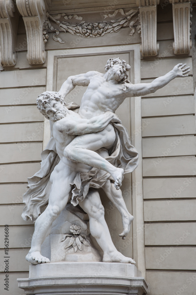 Statue of Hercules fighting Antaeus at Hofburg palace entrance, Vienna, Austria