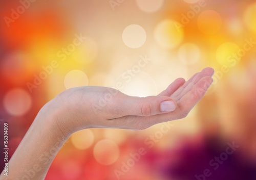 Hand posture curved with sparkling light bokeh background