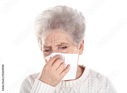 Mature ill woman with tissu...