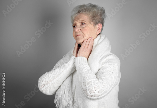 Senior ill woman with sore ...