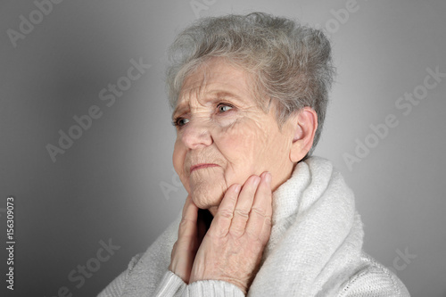 Senior ill woman with sore ...