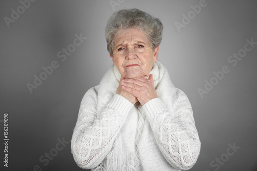 Senior ill woman with sore ...