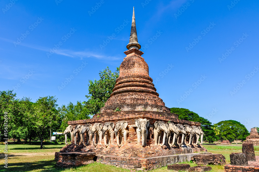 Stupa with elephant sculptures in Sukhotai, Thailand