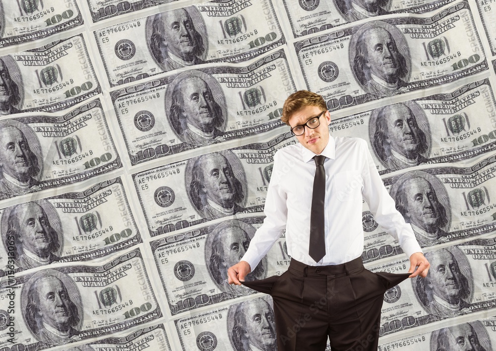 Young businessman with empty pockets. money background Young businessman with empty pockets. money background