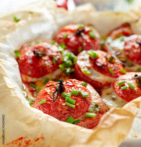 Baked tomatoes stuffed with spinach, cheese and herbs
