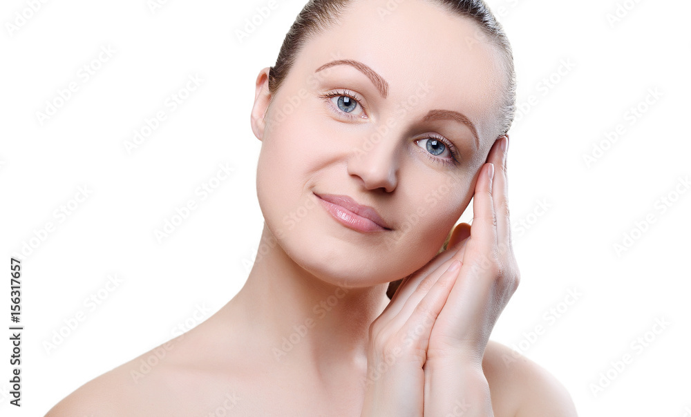 Portrait of a girl with nude make-up with hands near her face isolated on white background. Girl with clean healthy skin on white. Cosmetology, spa, medicine, beauty care. Beauty model. Nude makeup Portrait of a girl with nude make-up with hands near her face isolated on white background. Girl with clean healthy skin on white. Cosmetology, spa, medicine, beauty care. Beauty model. Nude makeup