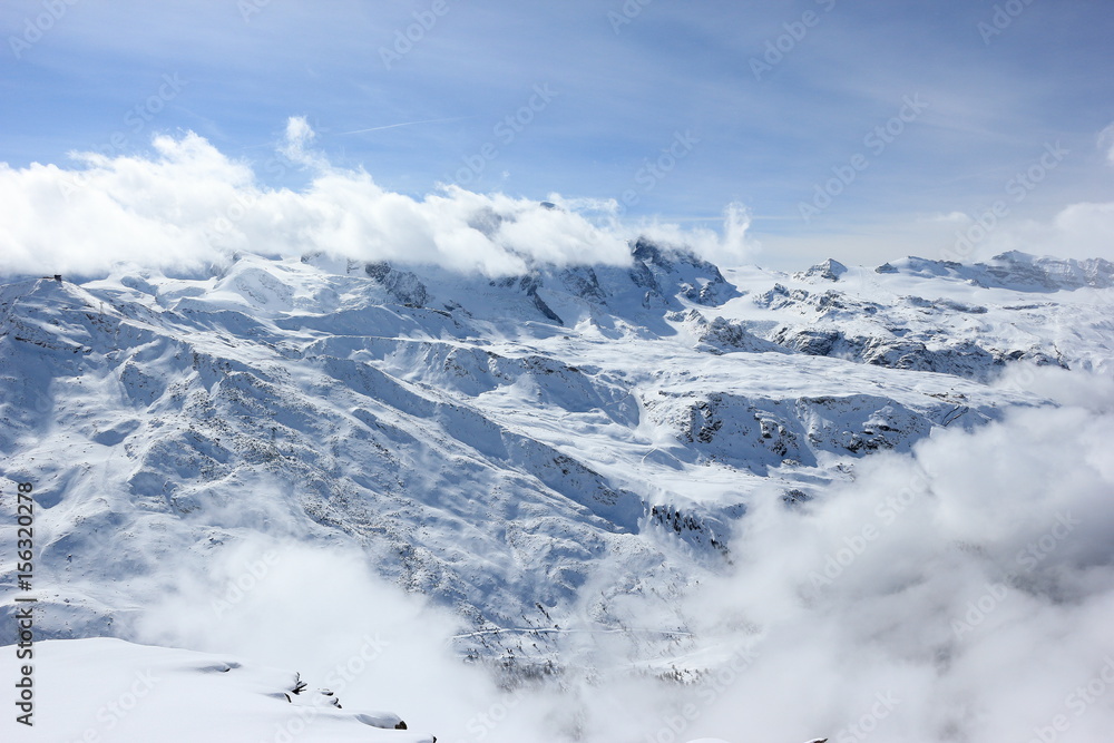 Fototapeta premium The view from the Rothorn (3,103 m) showcases the highest peaks of the Swiss Alps. Valais, Switzerland.
