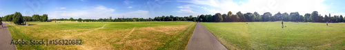 Tourists walk in Hyde Park, panoramic view, London