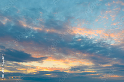 Fototapeta Naklejka Na Ścianę i Meble -  Clouds on a blue sky illuminated by the sun at sunset.