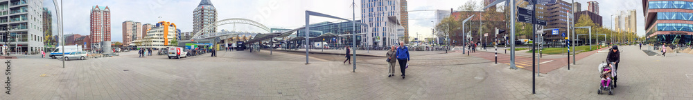ROTTERDAM, THE NETHERLANDS - APRIL 2015: Tourists along city streets. Rotterdam is a major tourist attraction in Holland