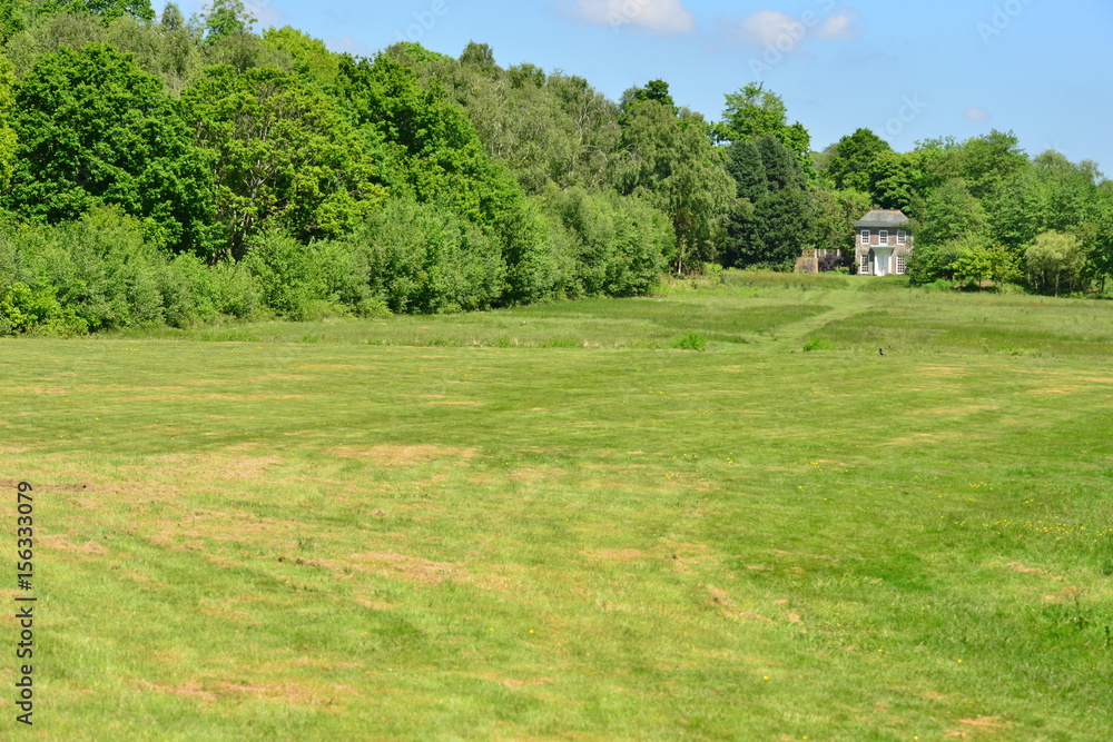A very large lawn area on a country estate in Sussex
