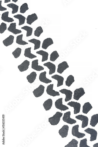 A trace from the wheel on the wall. Decoration of the wall by auto theme.