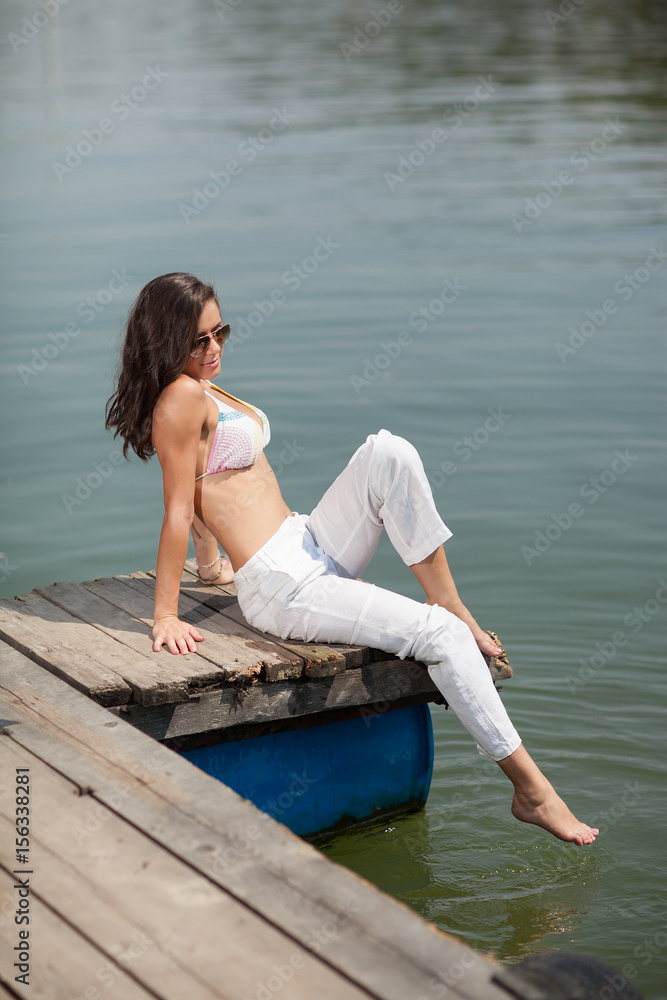 young girl on river bank .summer day