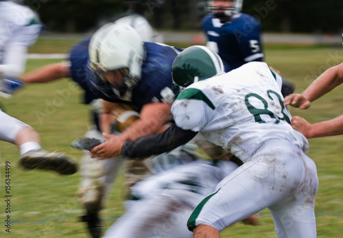 football player making tackle