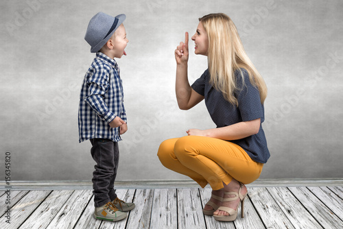 Tableau sur toile A young mother scolds her naughty little son
