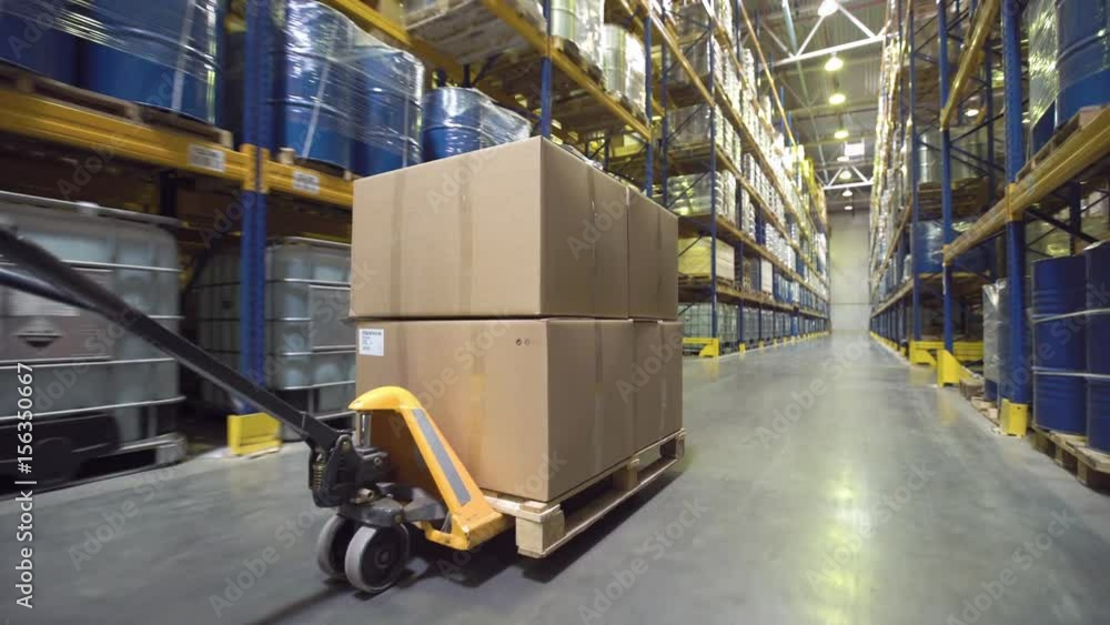 Cart with merchandise moving in warehouse Cart with merchandise moving in warehouse